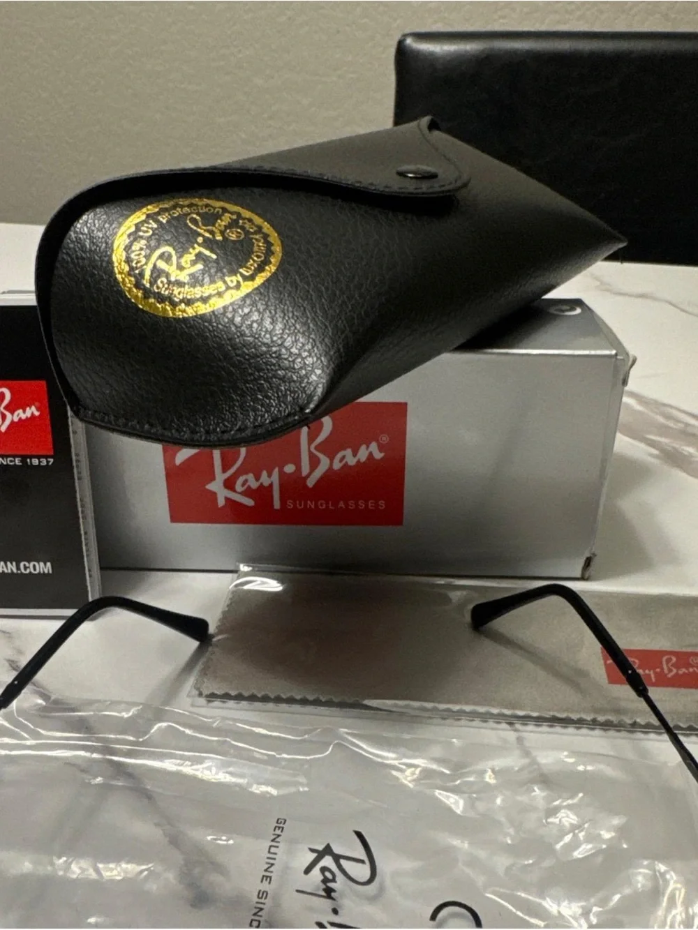 Ray-Ban Black Frame Sunglasses with Green Polarized Lenses